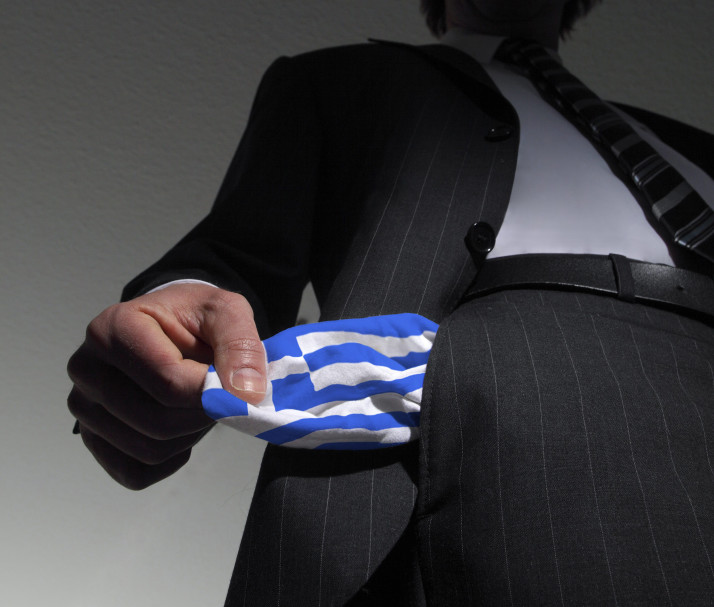 (GERMANY OUT) Symbolic photo: national bankruptcy of Greece, high taxes, Man in a suit with empty pockets in the national colours of Greece (Photo by Classen/ullstein bild via Getty Images)